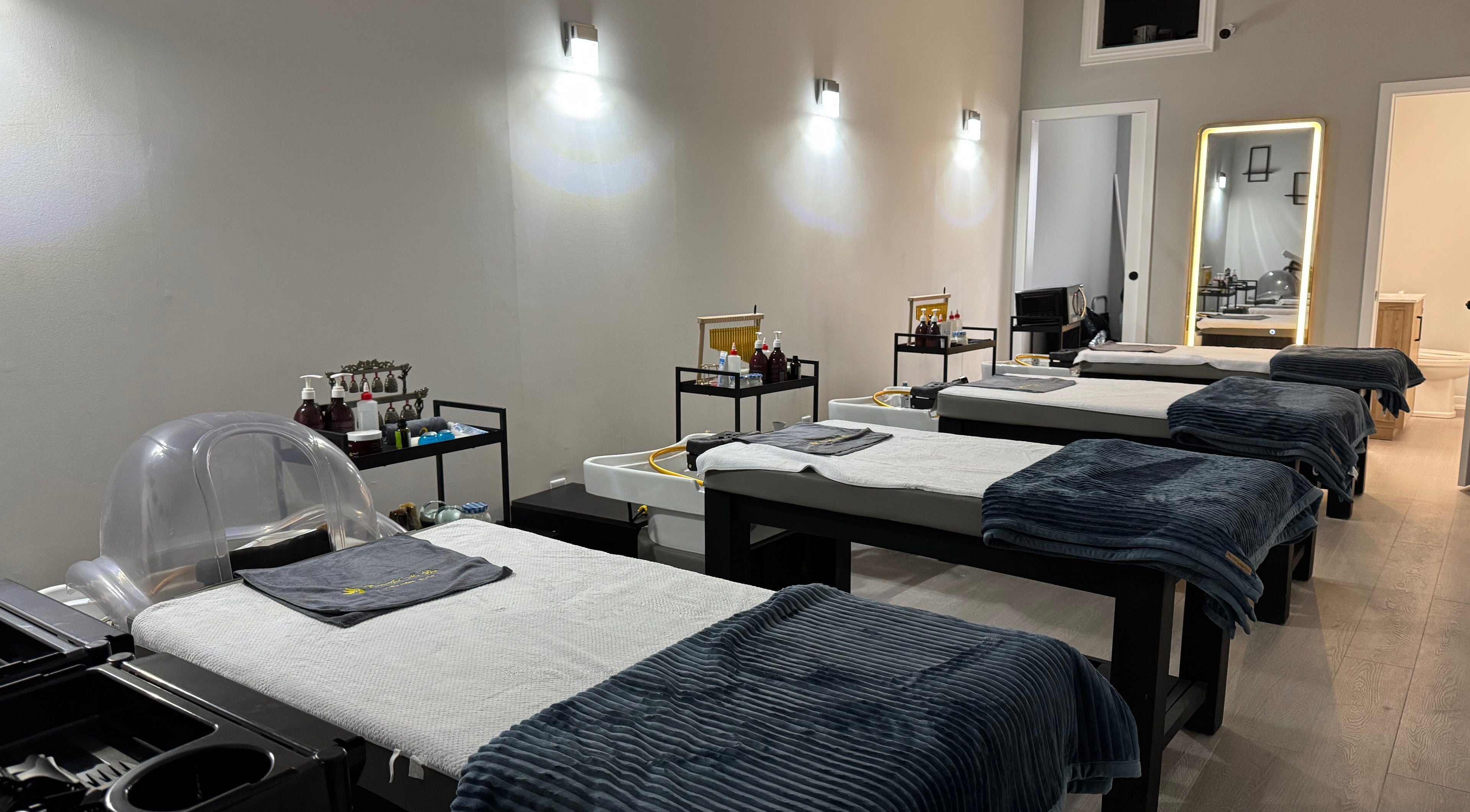 Calm treatment room at Beautiful Me Spa & Wellness Clinic, Toronto, Ontario, CA, showcasing massage tables.