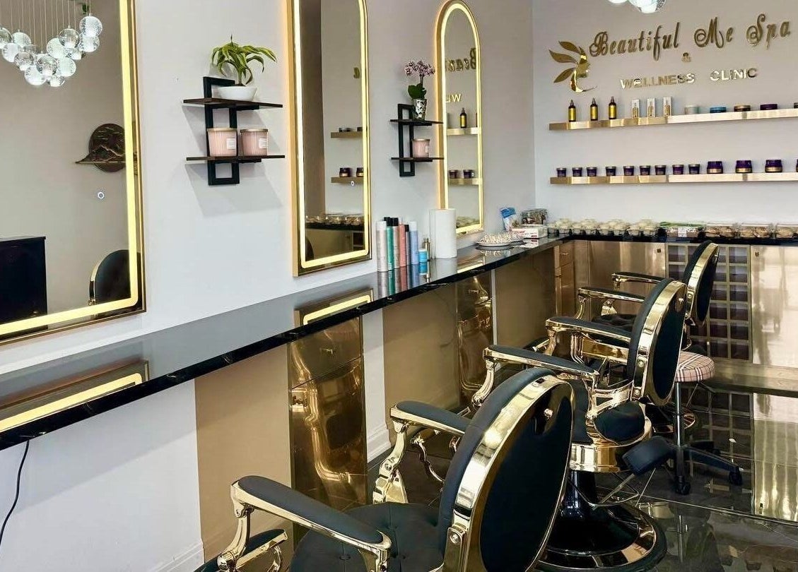 Interior of Beautiful Me Spa & Wellness Clinic in Toronto, Ontario, CA, featuring elegant mirrors and chairs.
