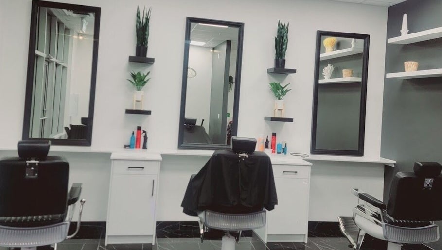 Modern salon chairs and mirrors at FadedByJass, Edmonton, Alberta, CA offer chic grooming spaces.