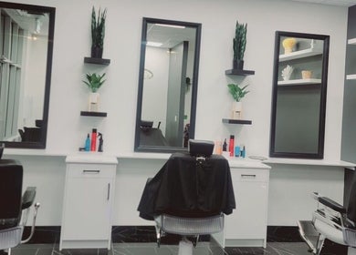 Modern salon chairs and mirrors at FadedByJass, Edmonton, Alberta, CA offer chic grooming spaces.