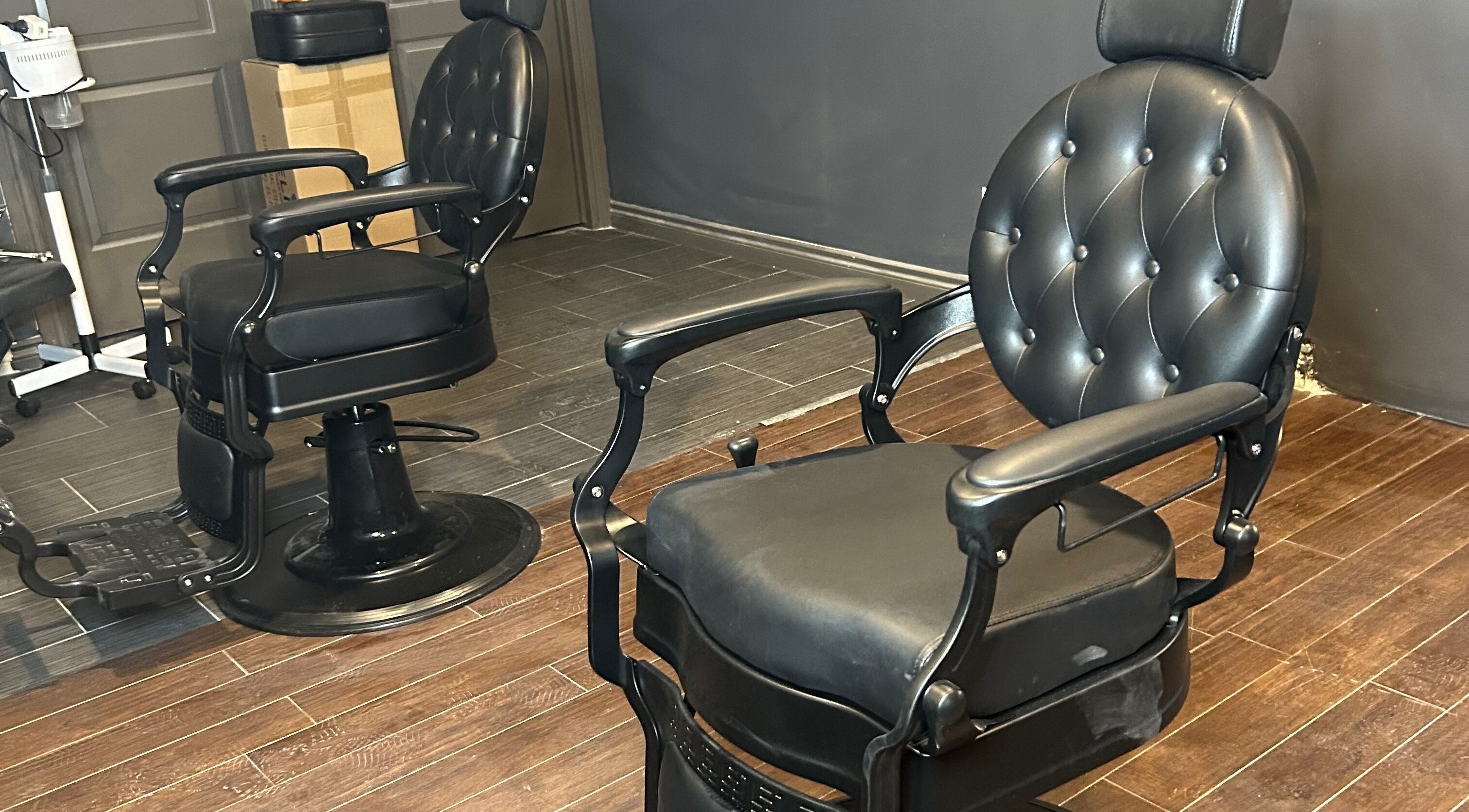 Luxurious barber chair at FadedByJass in Edmonton, Alberta, CA, highlighting sleek design and comfort.