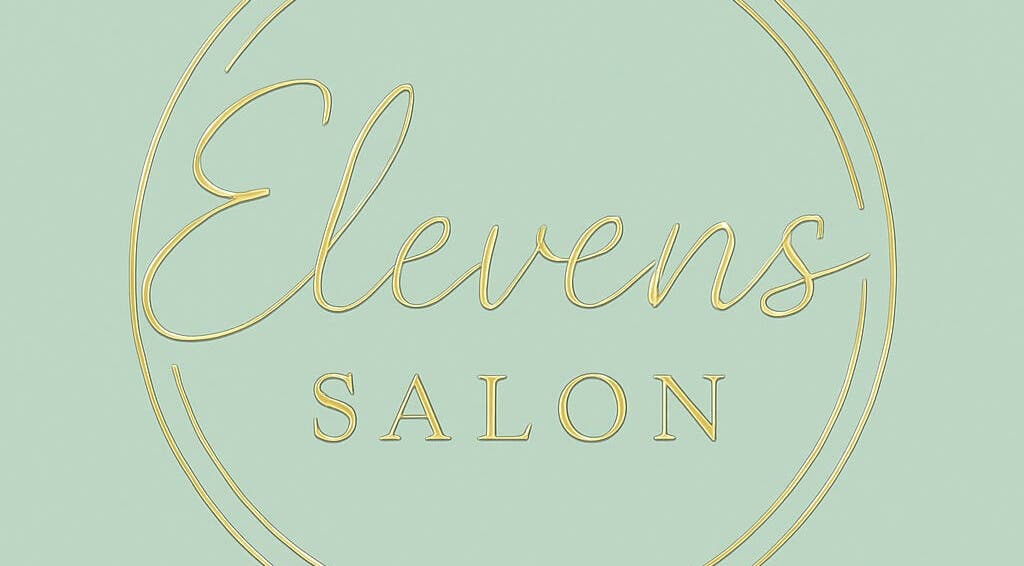 Elevens Salon logo in gold script on green, located in Morecambe, England, GB.