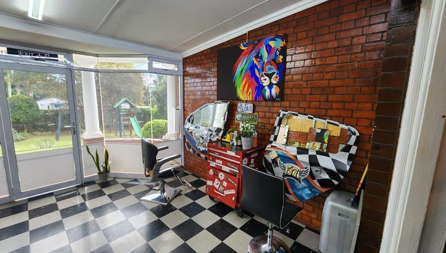 Modern interior of Blu Gel Hair Studio, Pietermaritzburg, Kwazulu-natal, ZA with colorful decor and stylish chairs.