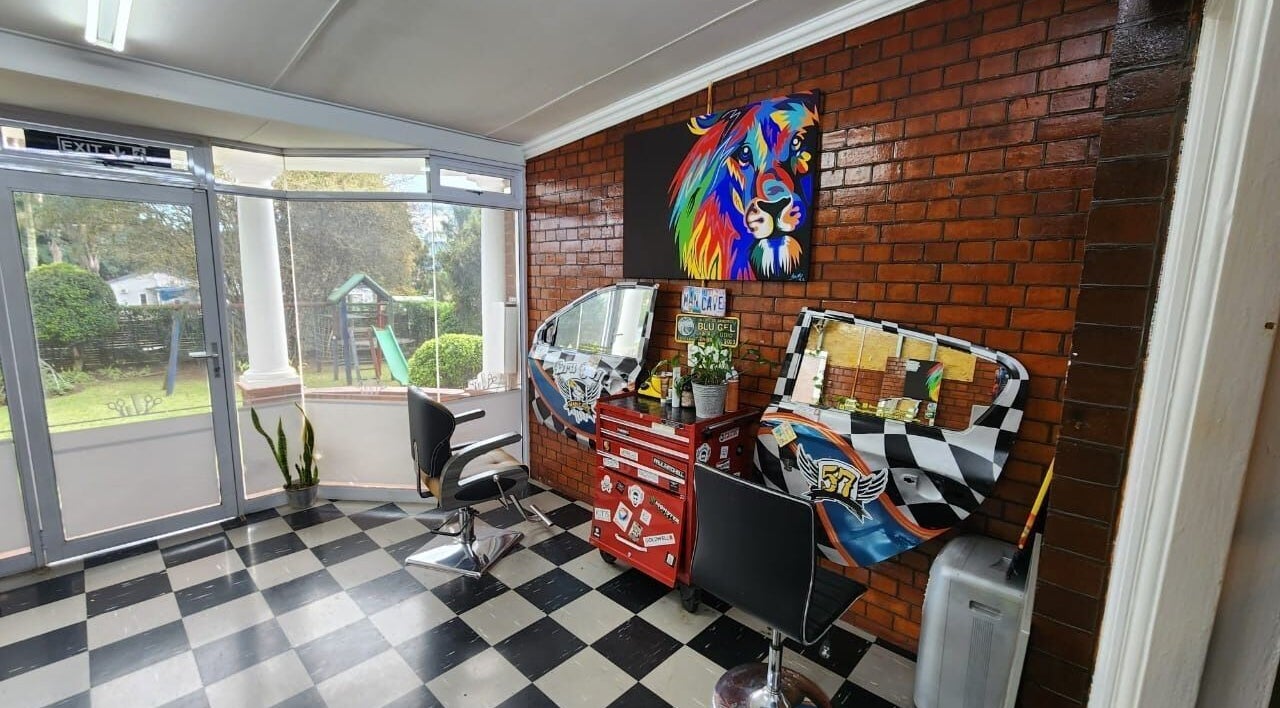 Modern interior of Blu Gel Hair Studio, Pietermaritzburg, Kwazulu-natal, ZA with colorful decor and stylish chairs.