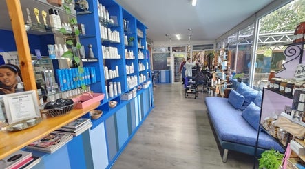 Blu Gel Hair Studio's modern interior in Pietermaritzburg, Kwazulu-natal, ZA showcasing stylish seating and products.
