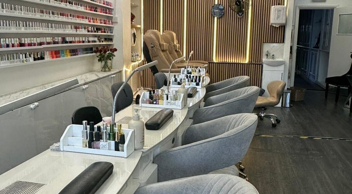 Elegant nail salon interior at Flawless Nails by Jenny in Woodford Green, England, GB, showcasing sleek manicure stations.