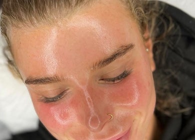 A satisfied client with glowing skin after a facial at Anna Does Skin, Surfers Paradise, Queensland, AU.