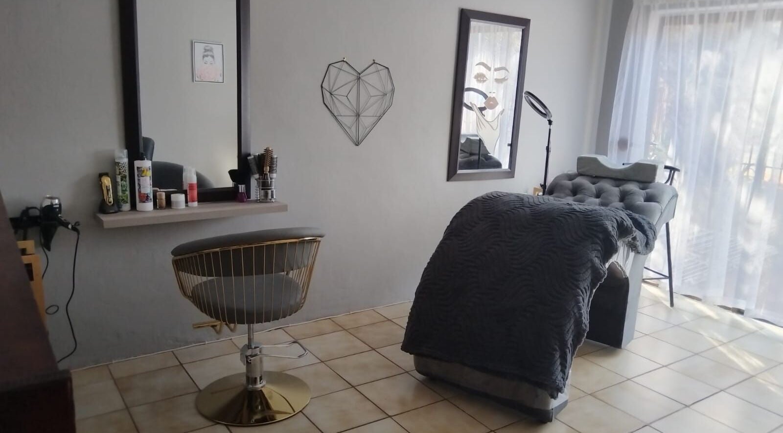 Modern salon interior at Annie's Beauty Salon, Kempton Park, Gauteng, ZA with styling chair and plush recliner.