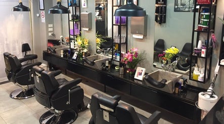 Modern interior of Capital barber (صالون العاصمة) in Amman, Amman Governorate, JO, with stylish decor and chairs.