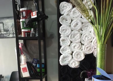Elegant towel display and shelves at Capital Barber (صالون العاصمة), Amman, Amman Governorate, JO.