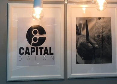 Capital barber (صالون العاصمة ), Amman: framed art and logo, highlighting barber skill and tradition.