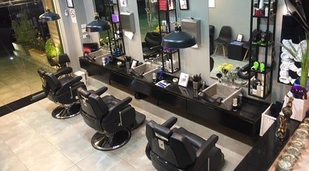Interior of Capital Barber (صالون العاصمة) in Amman, featuring sleek barber chairs and stylish decor.