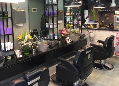 Interior of Capital barber (صالون العاصمة) in Amman, Amman Governorate, JO featuring modern chairs and decor.