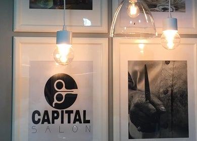Modern decor at Capital barber (صالون العاصمة), Amman, Amman Governorate, JO showcasing sleek lighting and artwork.