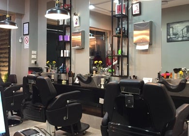 Modern interior of Capital barber (صالون العاصمة), Amman. Stylish chairs and decor reflecting urban elegance.