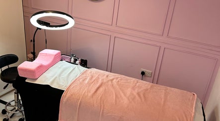 Comfortable pink beauty treatment bed at Petal Beauty by Lydia, Derby, England, GB, ready for clients.