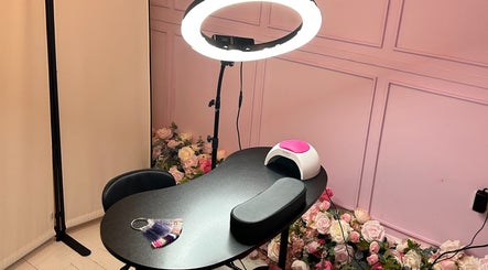 Nail station at Petal Beauty by Lydia in Derby, England, GB, with pink decor and flower accents.