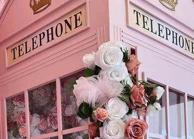 Charming pink phone booth adorned with roses at Petal Beauty by Lydia, Derby, England, GB.