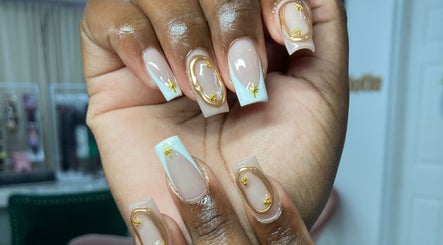 Intricate gold-accented nails by By Shanice in Falmouth, Trelawny Parish, JM.