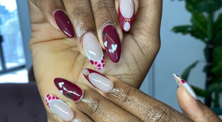 Stylish nail art with burgundy accents by By Shanice, Falmouth, Trelawny Parish, JM.