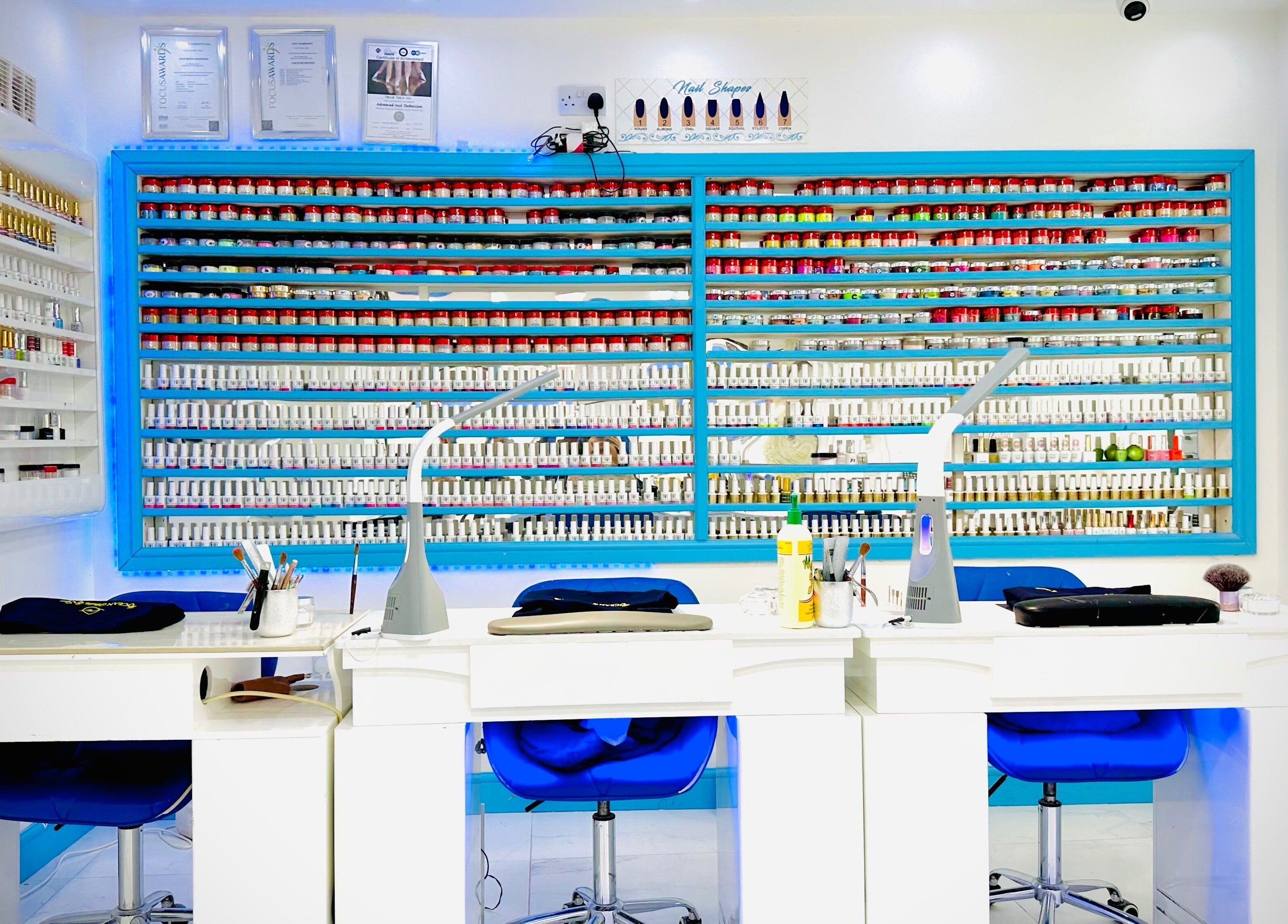 Vibrant nail polish display at Ocean Nails spa, Airdrie, Scotland, GB highlighting modern manicure space.