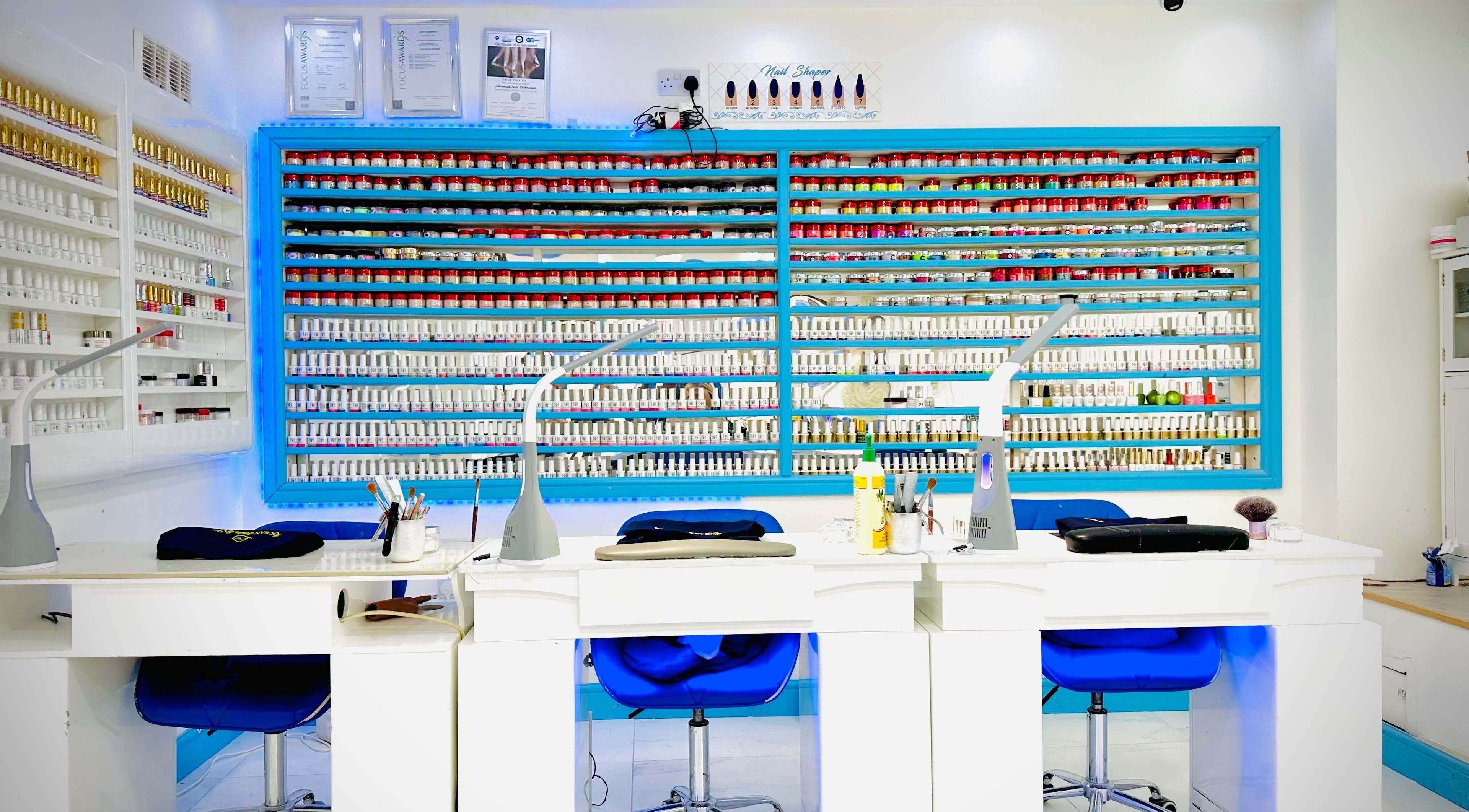 Vibrant nail polish display at Ocean Nails spa, Airdrie, Scotland, GB highlighting modern manicure space.
