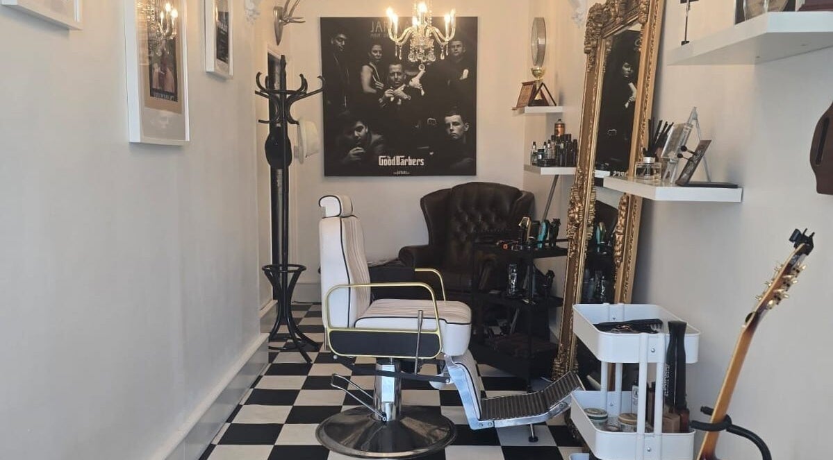 Elegant barber interior at THE SANDBANKS BARBER COMPANY, Poole, England, GB with vintage decor and stylish seating.