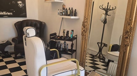 Chic barbershop interior at THE SANDBANKS BARBER COMPANY in Poole, England, GB with vintage decor and grooming tools.