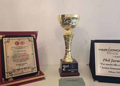 Awards displayed at THE SANDBANKS BARBER COMPANY, Poole, England, GB. Highlights achievement in barber artistry.