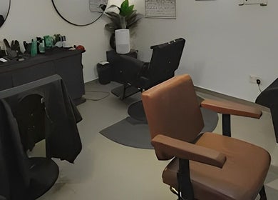 Stylish salon chairs and mirrors at Sculpt Studio in Kuala Lumpur, Wilayah Persekutuan Kuala Lumpur, MY.
