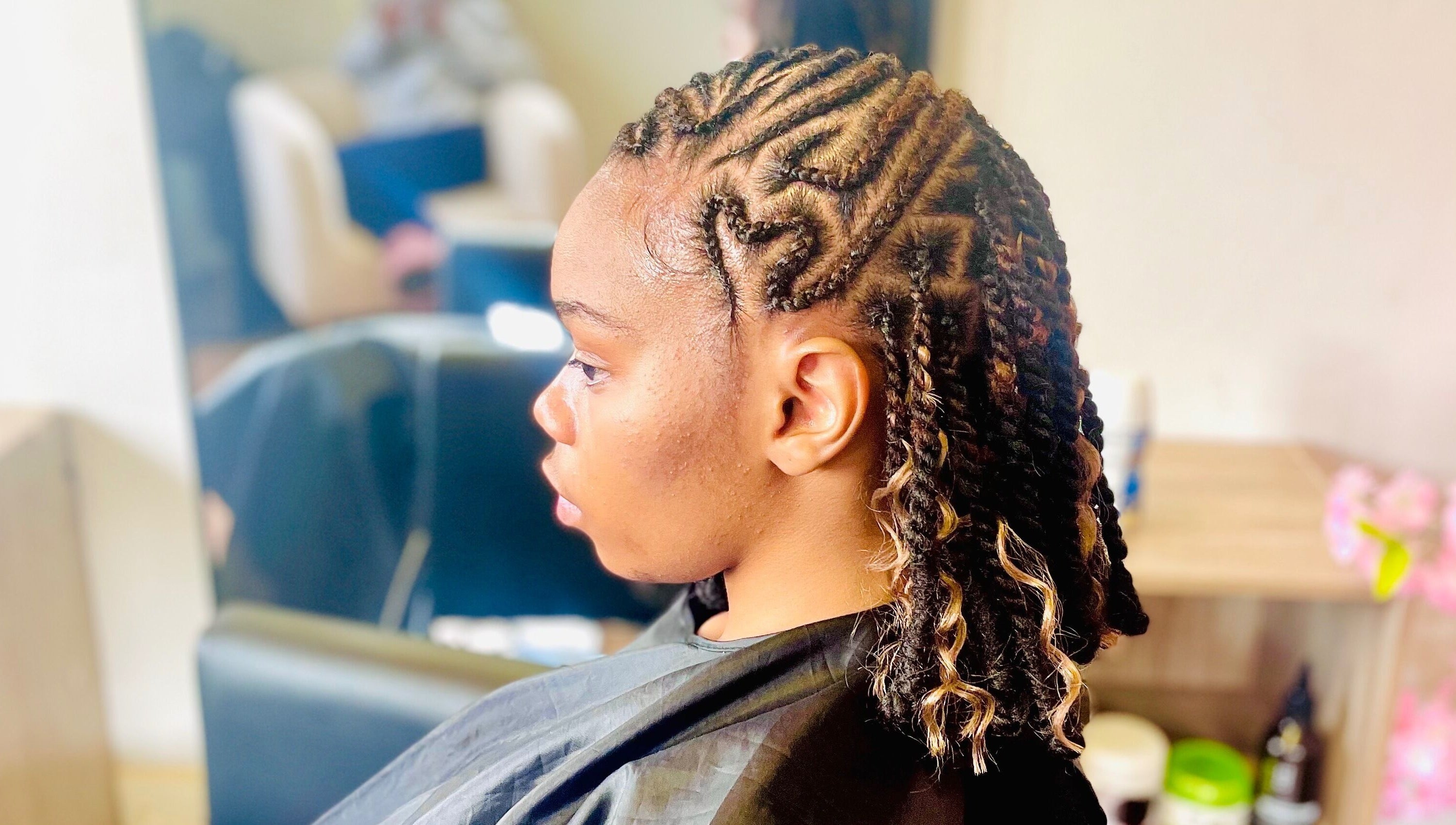 Intricate braided hairstyle at Sphiwe Beauty Studio, Pretoria, Gauteng, ZA.