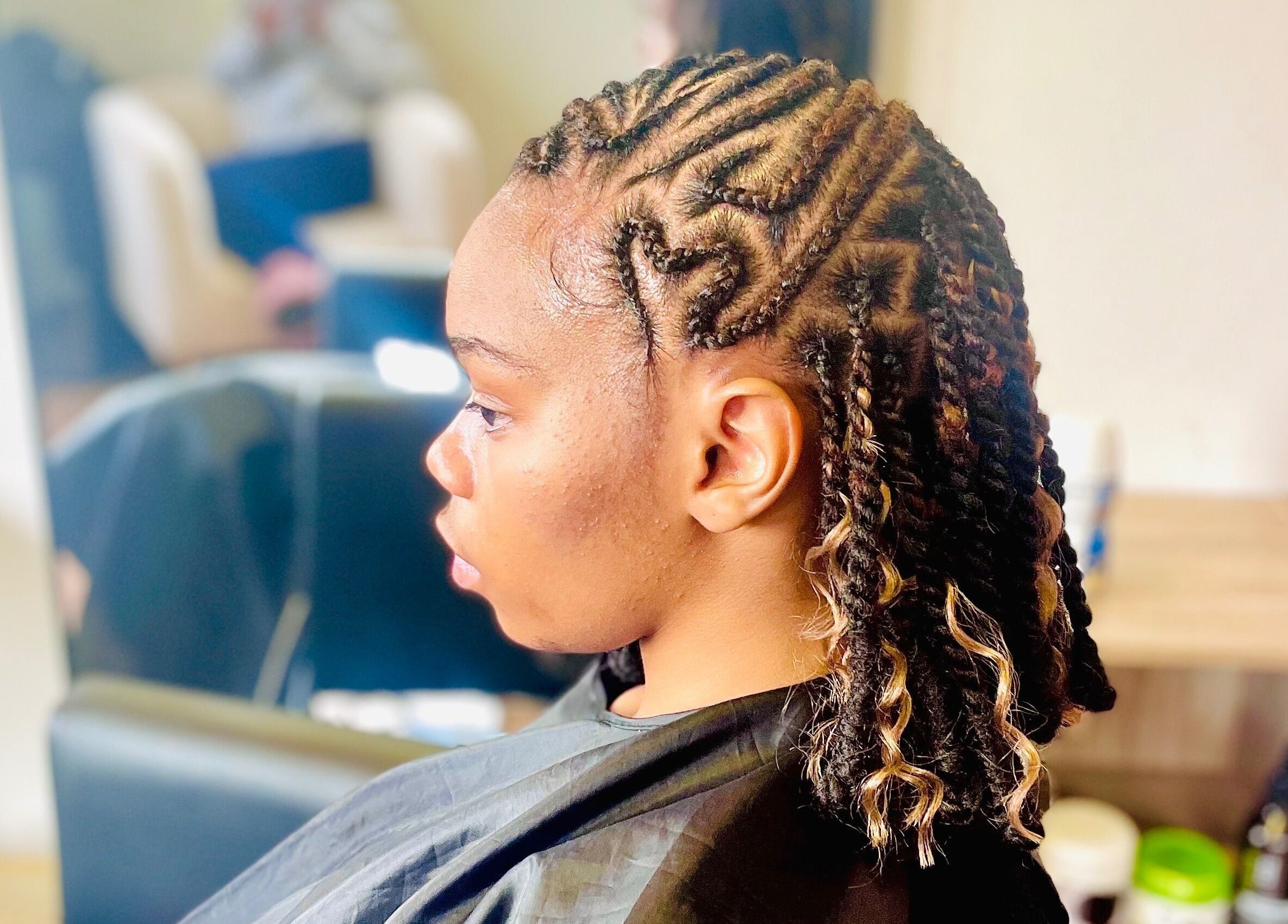 Intricate braided hairstyle at Sphiwe Beauty Studio, Pretoria, Gauteng, ZA.