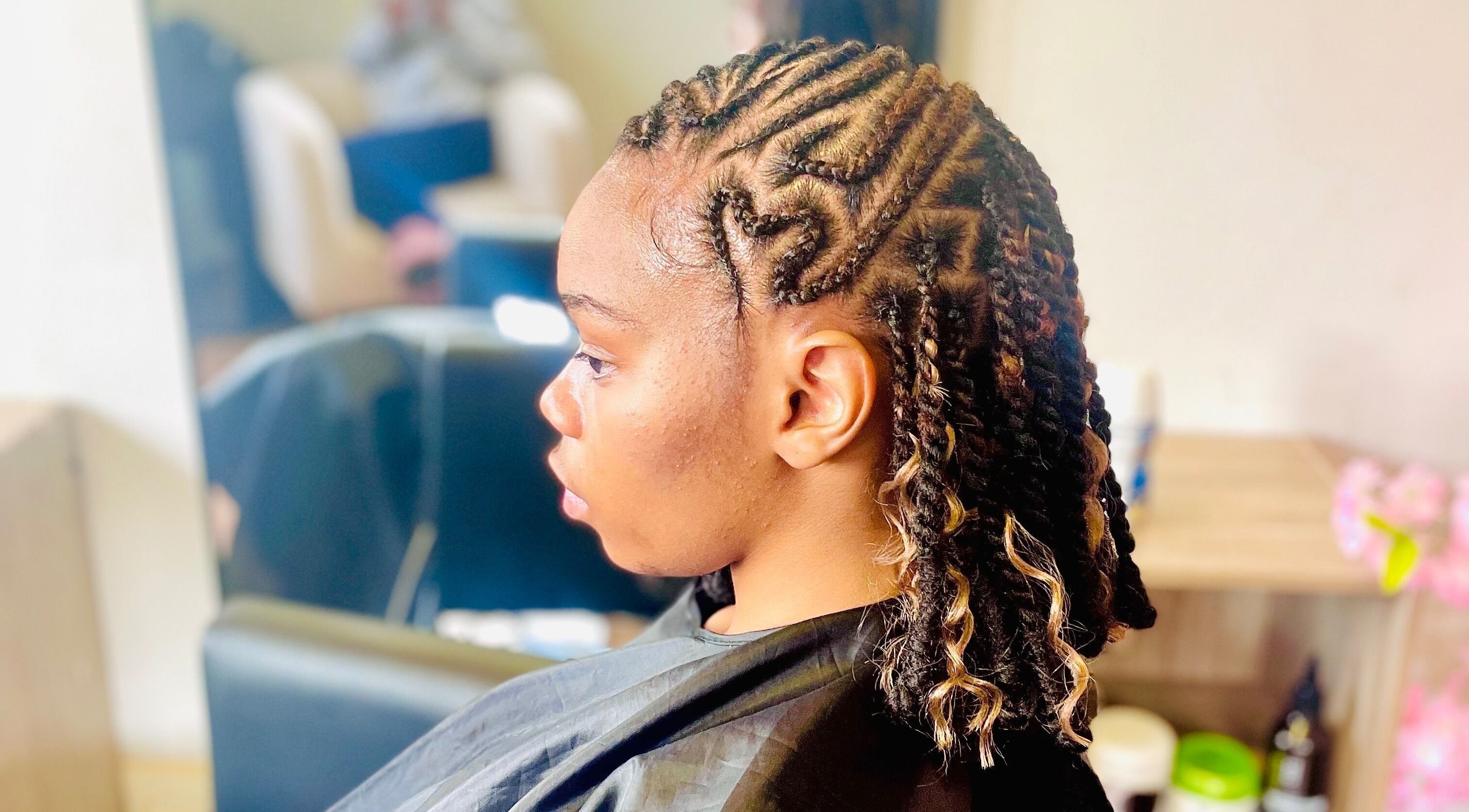 Intricate braided hairstyle at Sphiwe Beauty Studio, Pretoria, Gauteng, ZA.