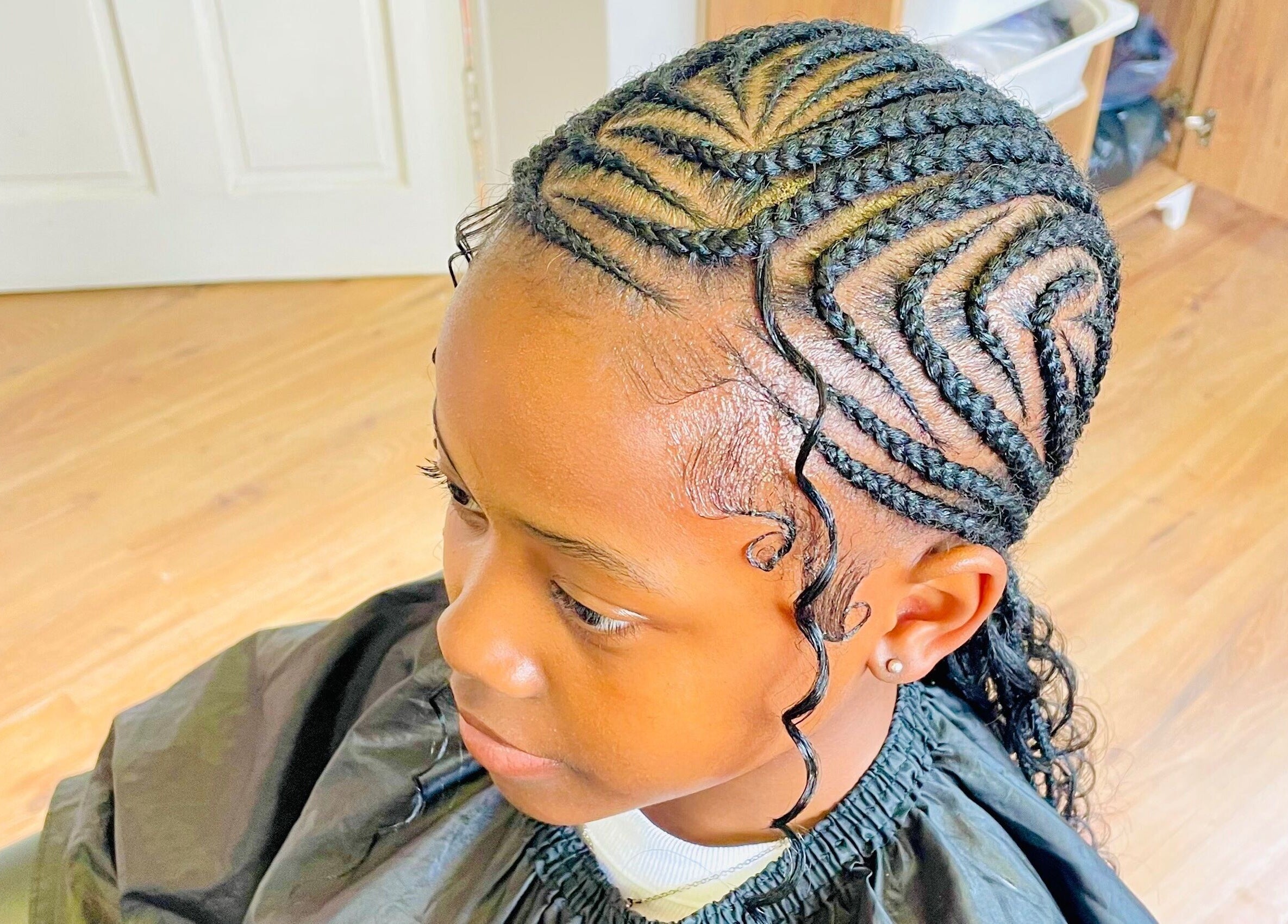 Stylish cornrow hairstyle at Sphiwe Beauty Studio, Pretoria, Gauteng, ZA.