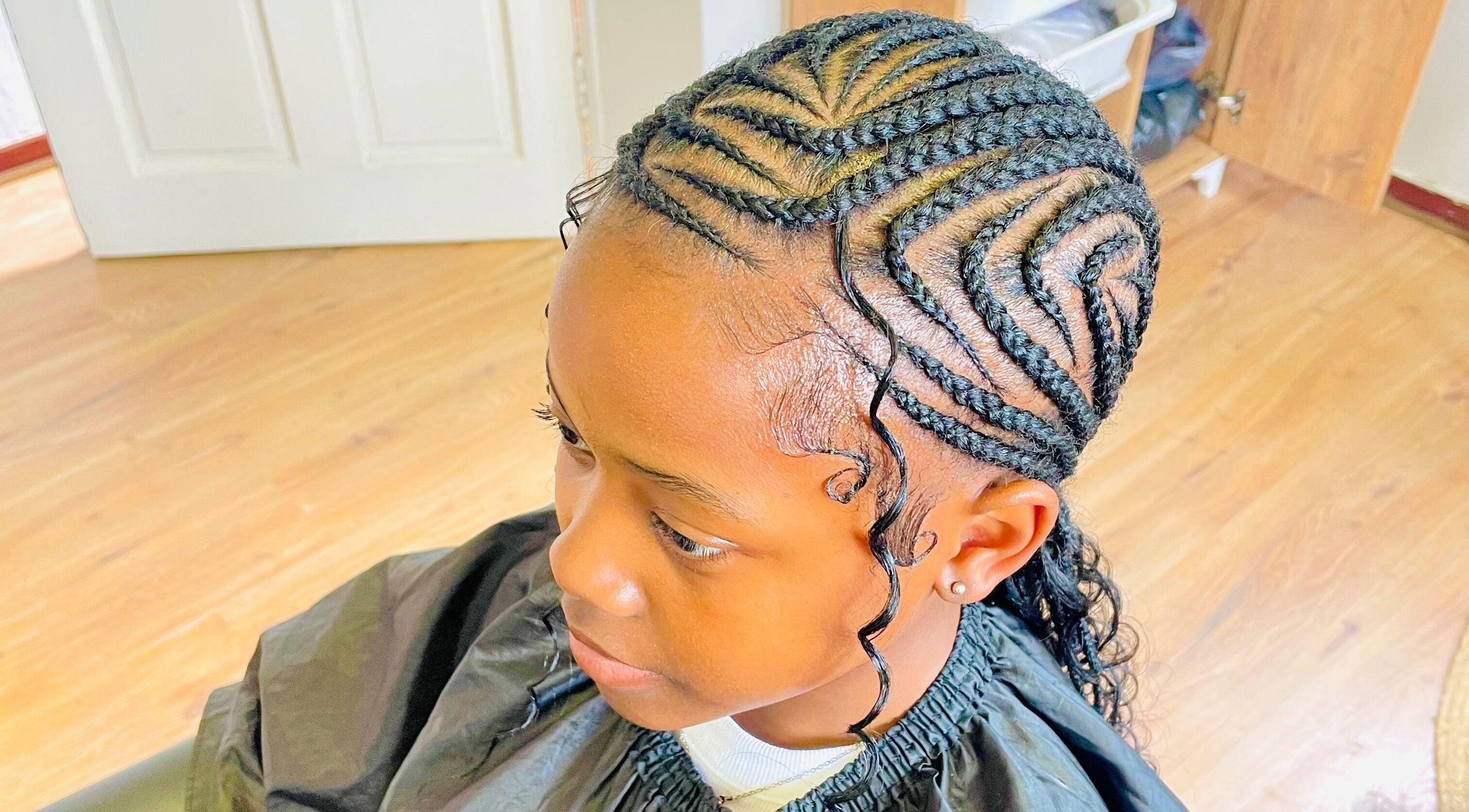 Stylish cornrow hairstyle at Sphiwe Beauty Studio, Pretoria, Gauteng, ZA.