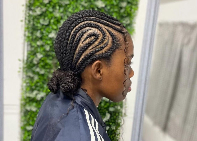 Intricate cornrow hairstyle at Sphiwe Beauty Studio, Pretoria, Gauteng, ZA.