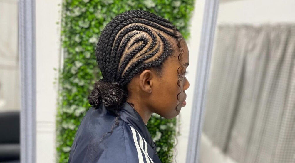 Intricate cornrow hairstyle at Sphiwe Beauty Studio, Pretoria, Gauteng, ZA.