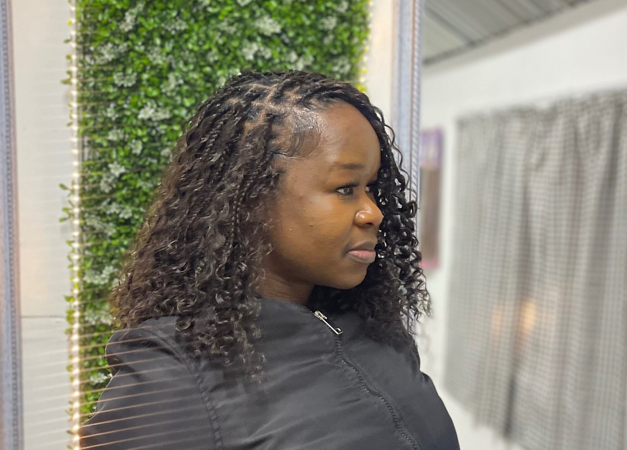 Woman with curly hairstyle at Sphiwe Beauty Studio, Pretoria, Gauteng, ZA showcasing modern beauty trends.