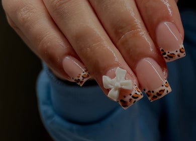 Elegant nail design with bow detail at Cullen & Co, Mullingar, County Westmeath, IE.