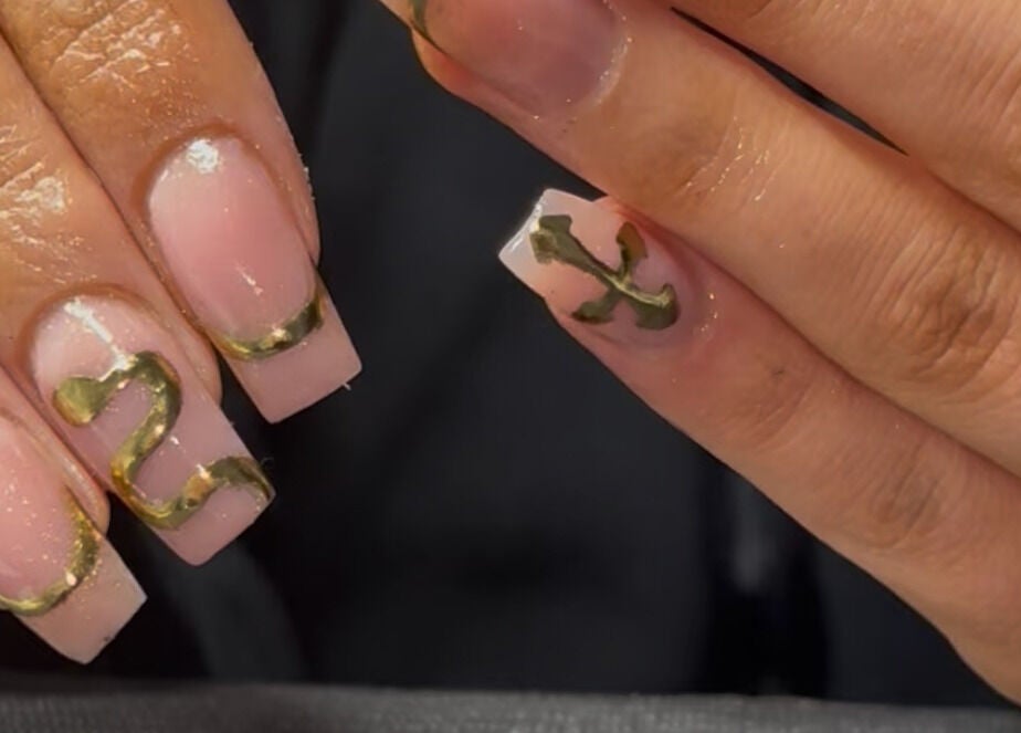 Elegant gold-accented nail art at Cullen & Co, Mullingar, County Westmeath, IE, showcasing creativity and style.
