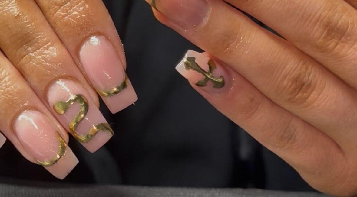 Elegant gold-accented nail art at Cullen & Co, Mullingar, County Westmeath, IE, showcasing creativity and style.