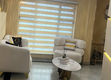 Relaxing seating area at Glamour Haven Beauty, Johannesburg, Gauteng, ZA with plush chairs and decor.