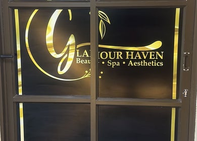 Entrance sign of Glamour Haven Beauty in Johannesburg, Gauteng, ZA, featuring elegant gold lettering.