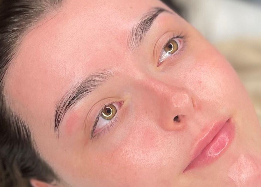 Close-up of a woman's glowing skin after a spa treatment at Glow By Molly in Tywyn, Wales, GB.