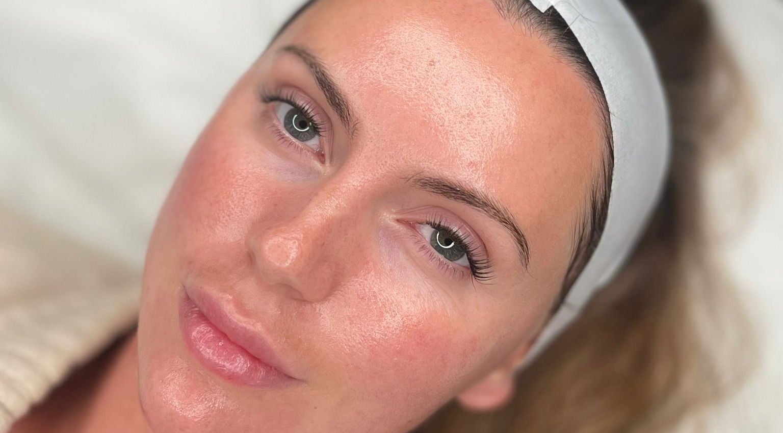 Rejuvenated client after facial at Glow By Molly, Tywyn, Wales, GB, showcasing smooth and glowing skin.