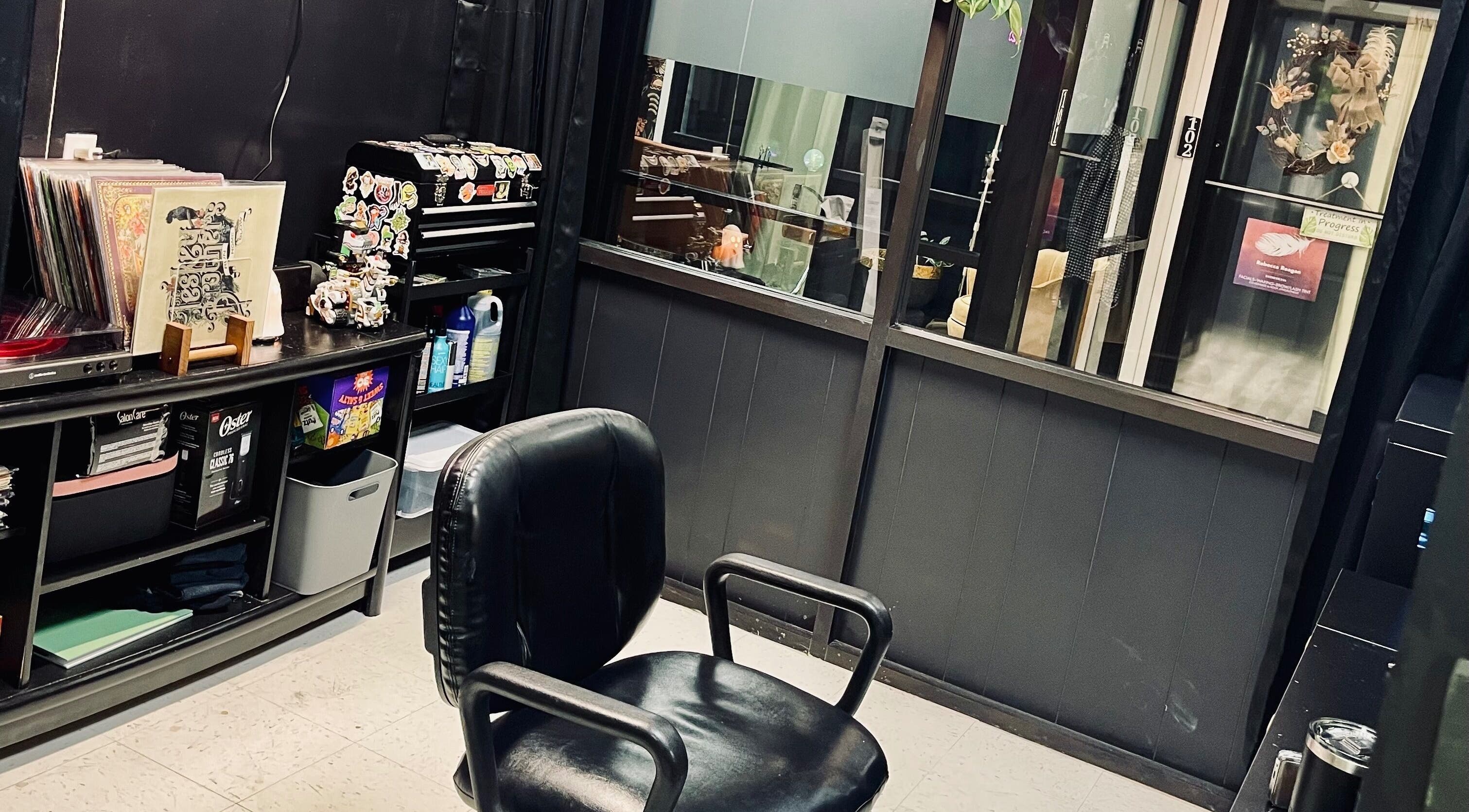 Cozy hair styling station at The Midnight Mane, Cleburne, Texas, US, with a sleek black chair and decor.