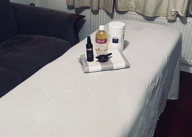 Massage table with oils at Peak Recovery Sports Therapy, Frampton Cotterell, England, GB.