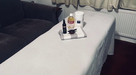 Massage table with oils at Peak Recovery Sports Therapy, Frampton Cotterell, England, GB.