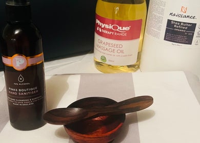Therapy oils and wooden bowl at Peak Recovery Sports Therapy, Frampton Cotterell, England, GB.