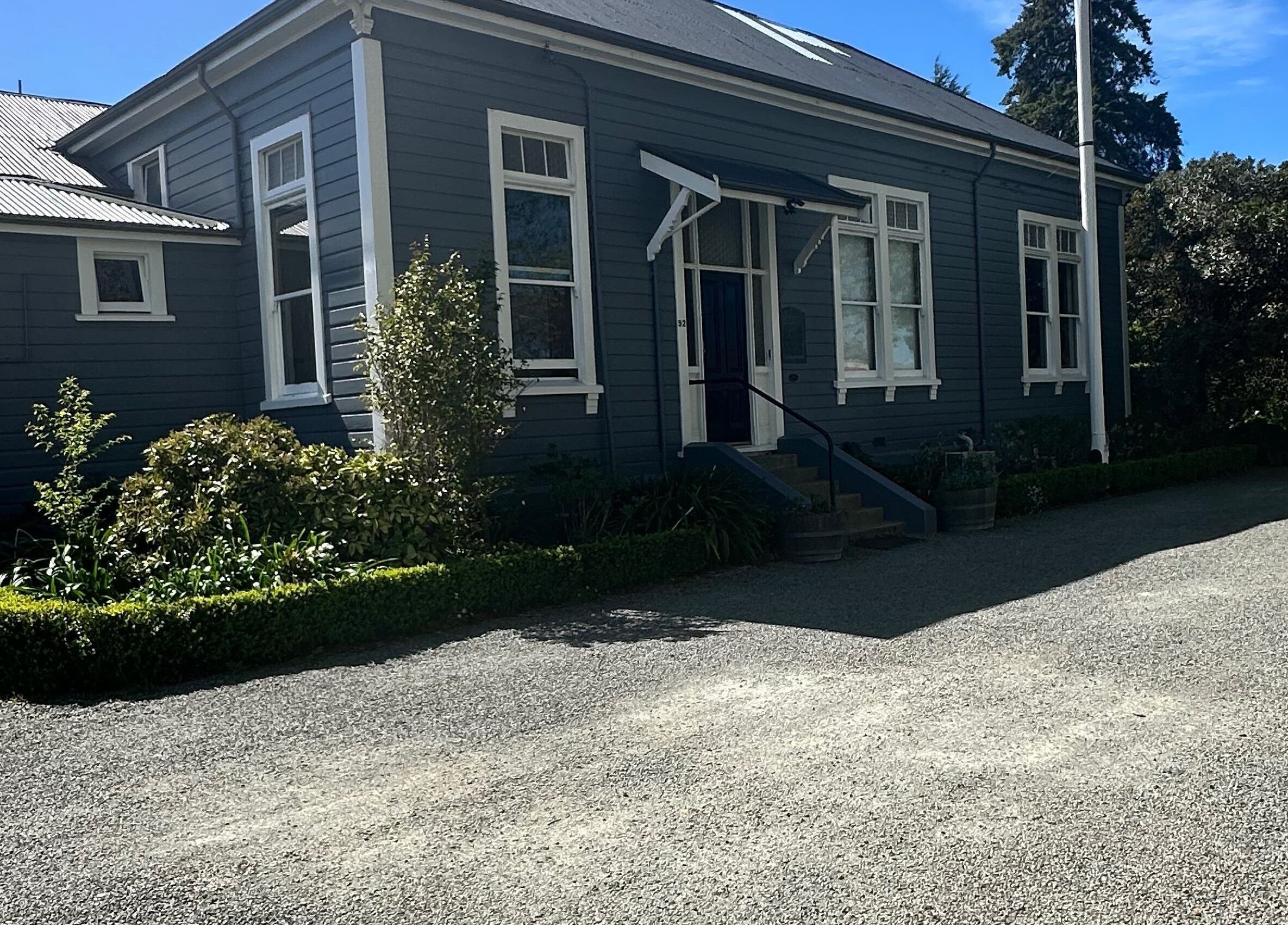 Front view of Alchemy Hair & Beauty in Blenheim, Marlborough Region, NZ showcasing its quaint exterior.